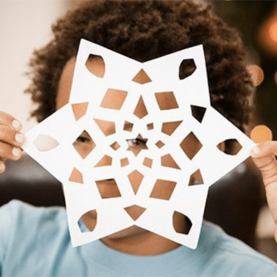 A boy with paper cut star