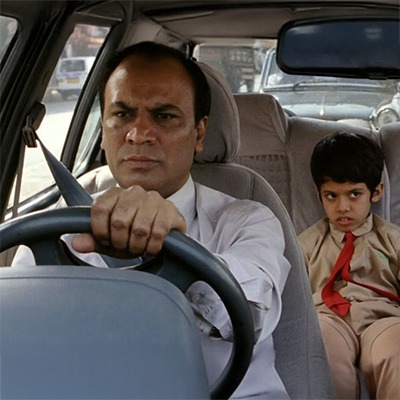 A sad and frustrated child sitting in a car