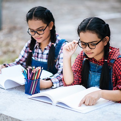 Group of students studying in library Image source