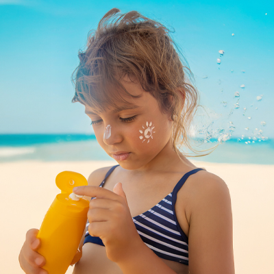girls using suncreen